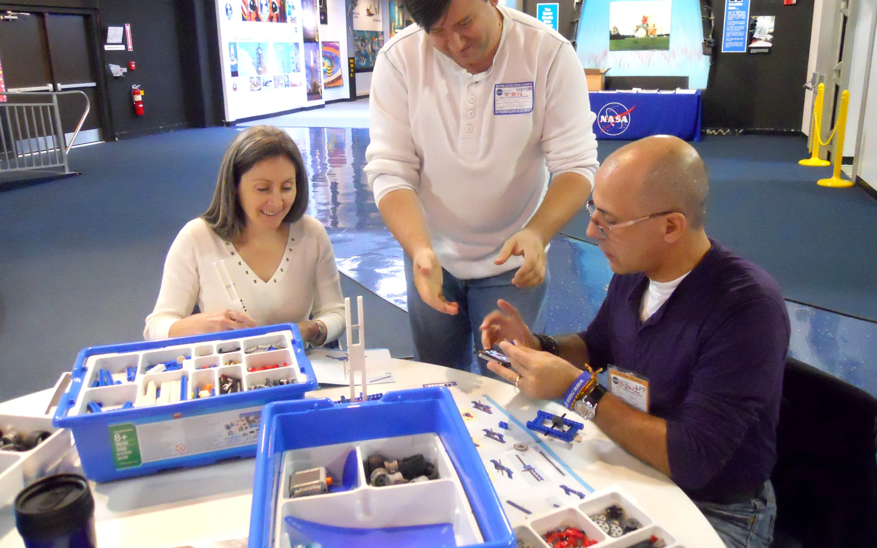 K-12 educators collaborating around a hands-on workshop table